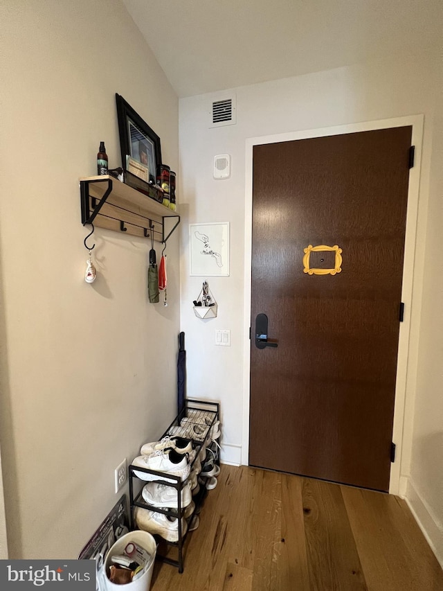 doorway to outside with hardwood / wood-style floors