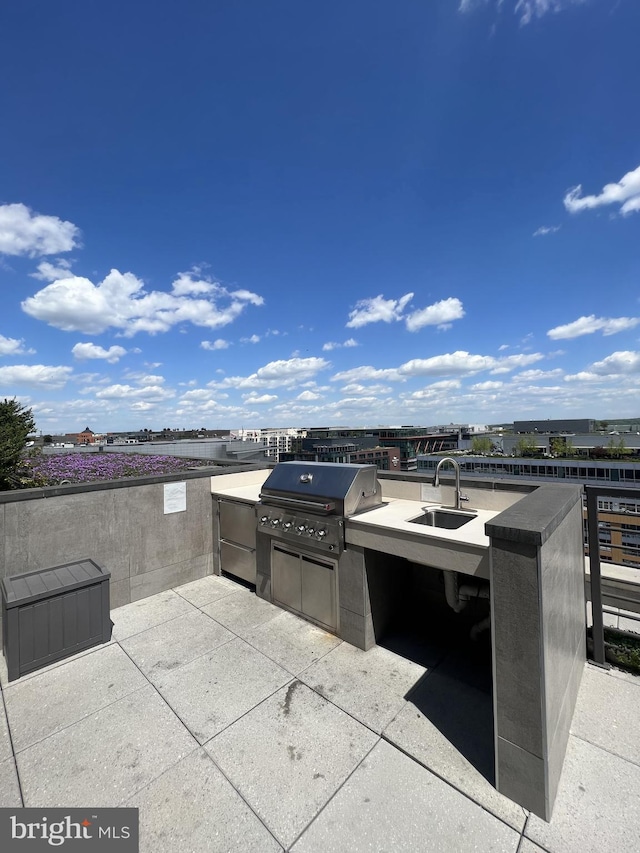 view of patio featuring sink, grilling area, and exterior kitchen