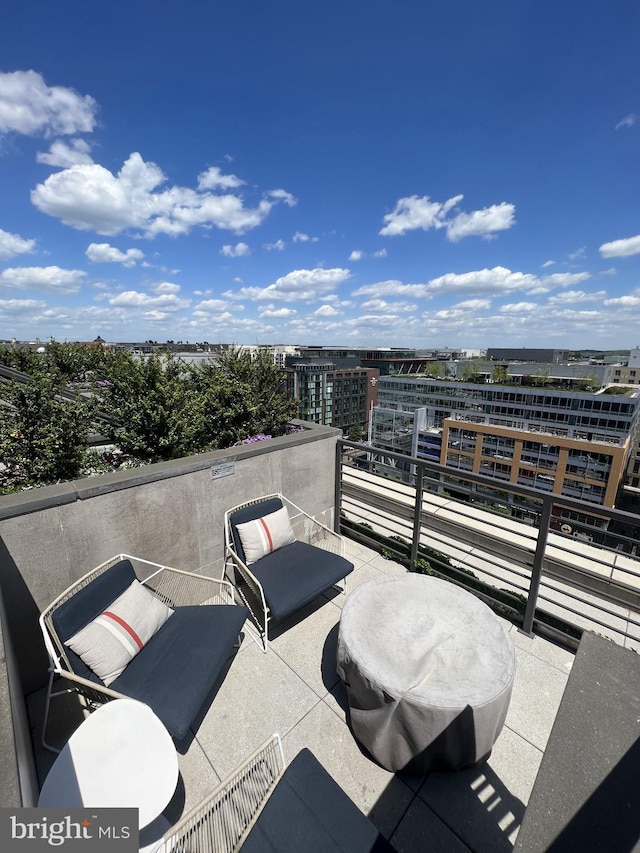 view of patio featuring a balcony