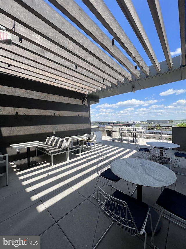 view of patio / terrace with an outdoor hangout area and a pergola