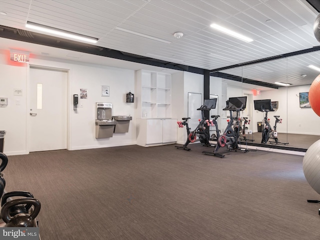 workout area with dark carpet