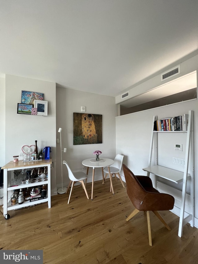 dining space featuring hardwood / wood-style flooring