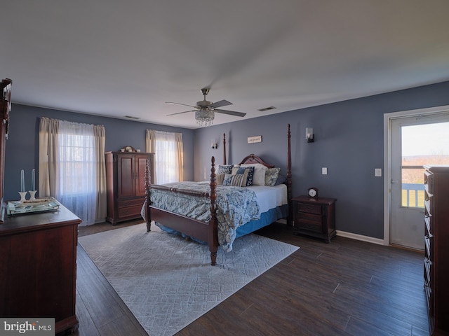 bedroom featuring dark wood-type flooring, ceiling fan, and access to exterior