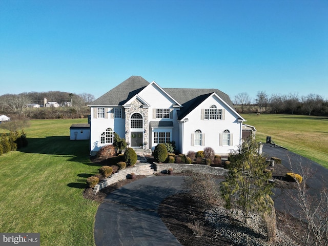 view of front of home with a front lawn