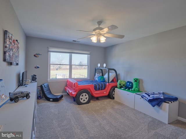 playroom with carpet and ceiling fan