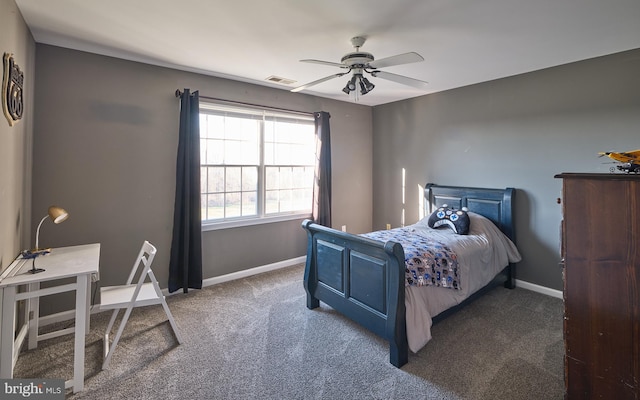 bedroom featuring dark colored carpet and ceiling fan