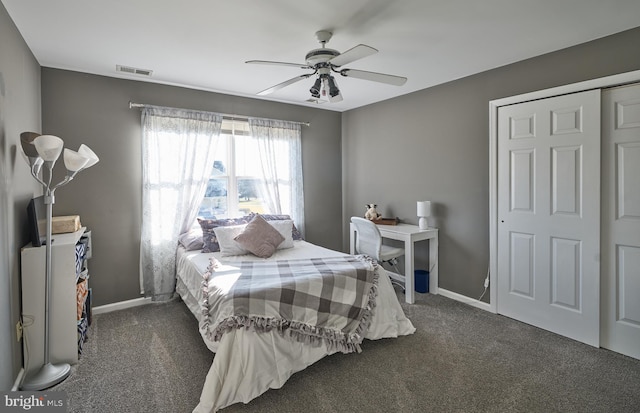 carpeted bedroom with ceiling fan and a closet