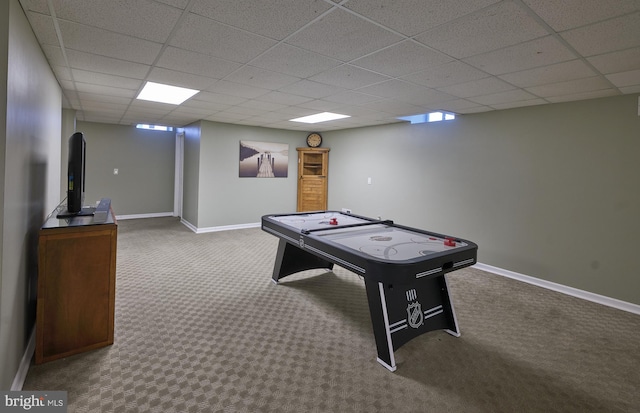 playroom with carpet and a paneled ceiling