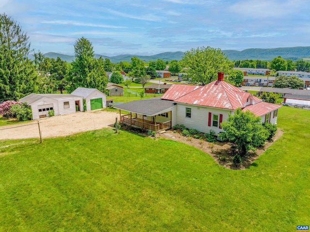 birds eye view of property featuring a mountain view