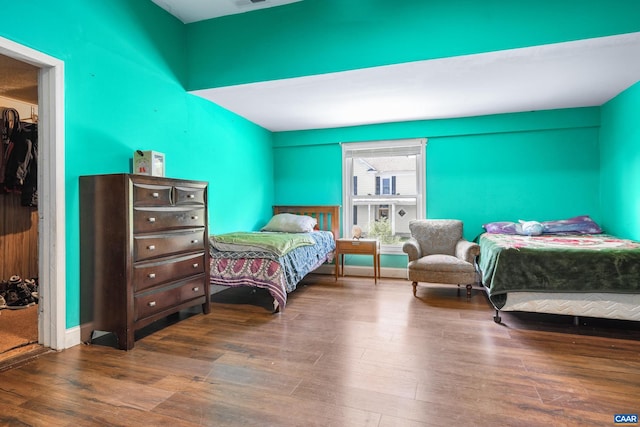 bedroom with wood-type flooring