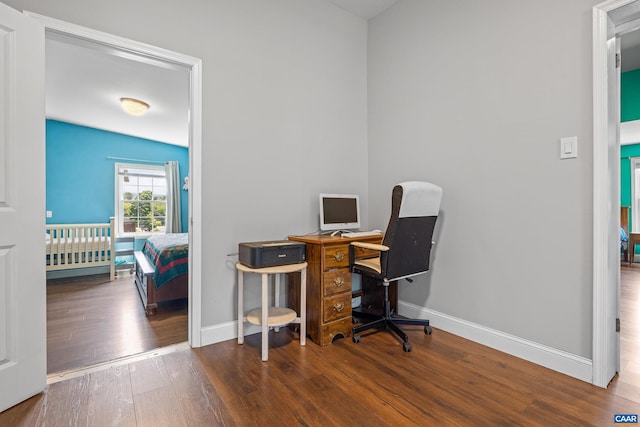 office space featuring dark wood-type flooring