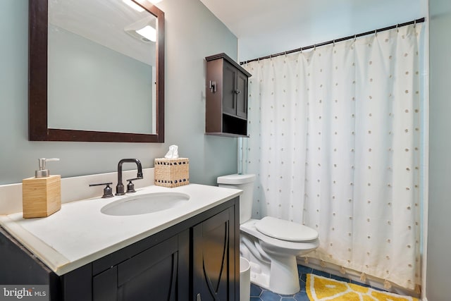 bathroom with tile patterned flooring, vanity, toilet, and a shower with shower curtain