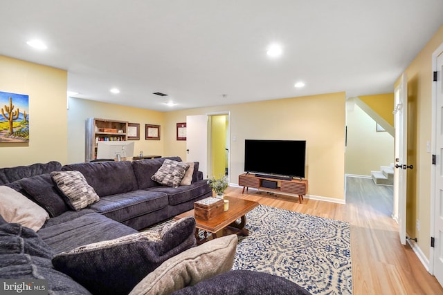 living room with light hardwood / wood-style flooring