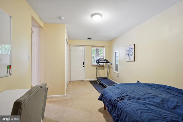 bedroom with light colored carpet