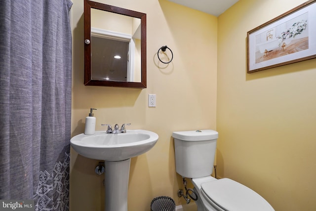 bathroom with toilet and sink