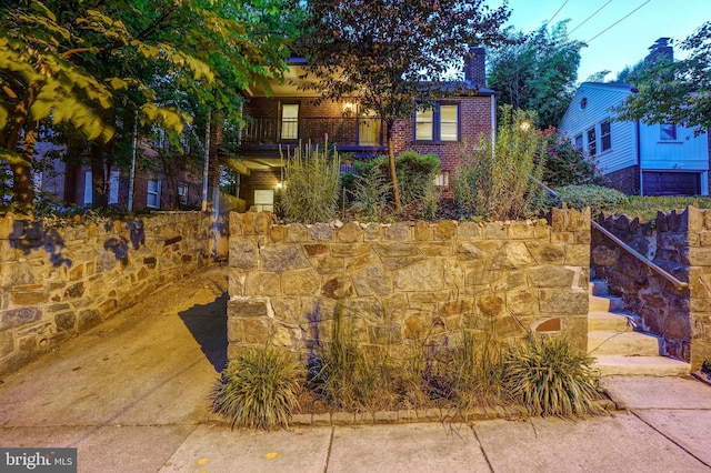 obstructed view of property featuring a balcony