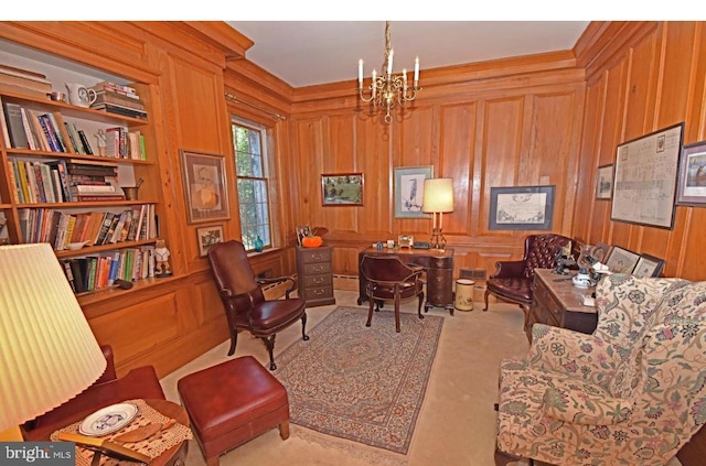 carpeted office featuring wooden walls and a chandelier