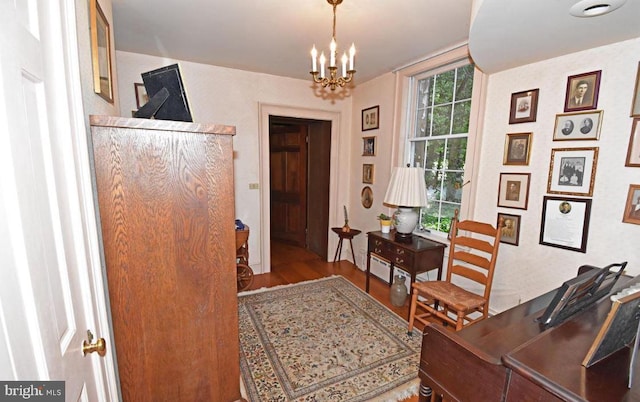 office space with hardwood / wood-style flooring and a chandelier