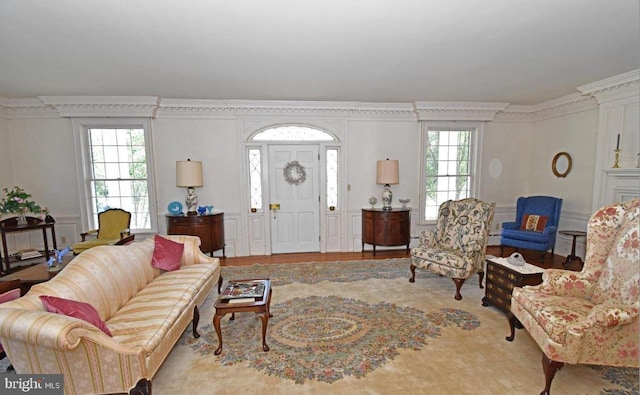 living room with ornamental molding and hardwood / wood-style floors