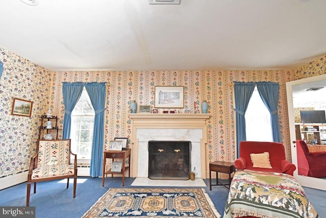 living room with carpet flooring and a high end fireplace