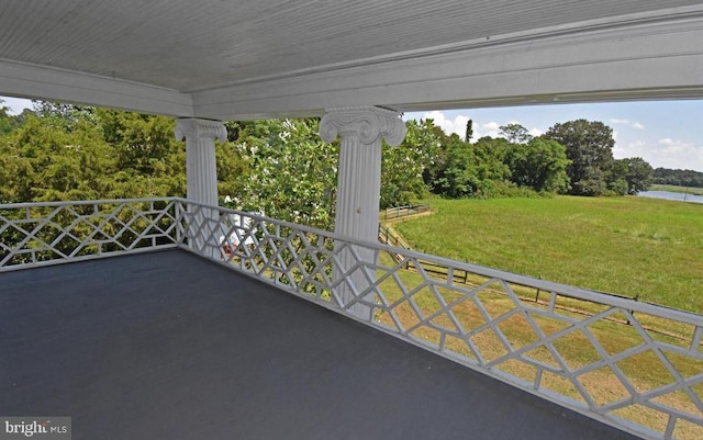 view of patio featuring a balcony