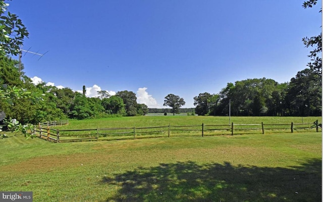 view of yard with a rural view