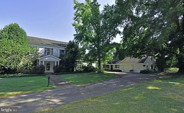 view of front of home with a front lawn