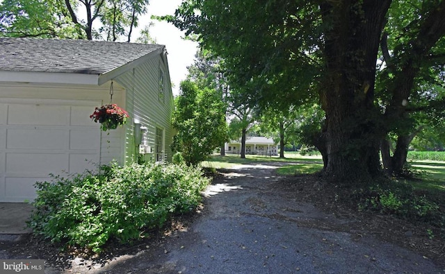 view of side of property featuring a garage