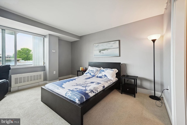 bedroom featuring carpet and radiator heating unit