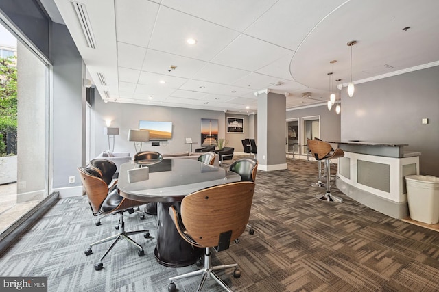 office space featuring ornamental molding and dark colored carpet