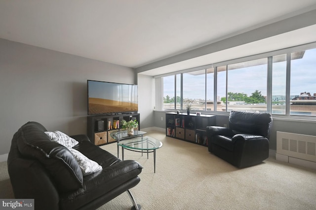 living room with a wealth of natural light and carpet floors