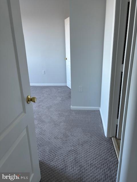 interior space with dark colored carpet