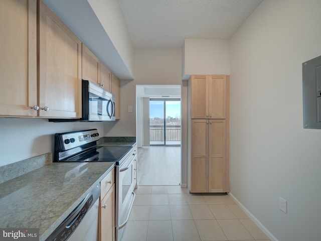 2230 George C Marshall Dr Unit 1127, Falls Church, VA 22043 - kitchen featuring stainless steel appliances, light brown cabinets, electric panel, light tile patterned floors, and baseboards