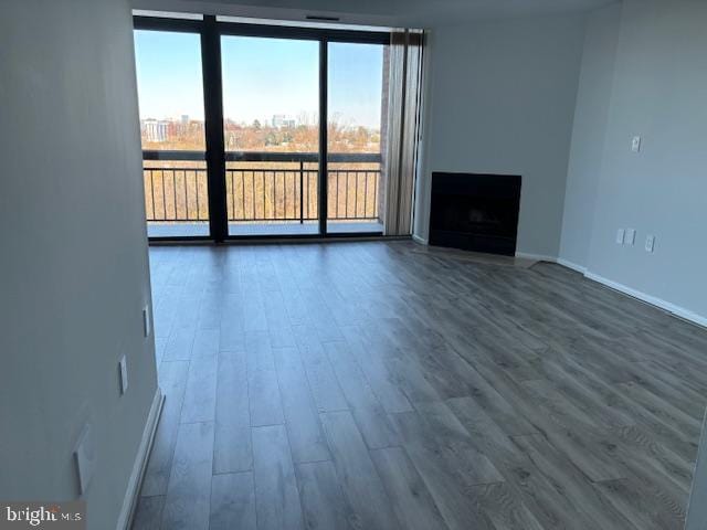 unfurnished living room with hardwood / wood-style floors