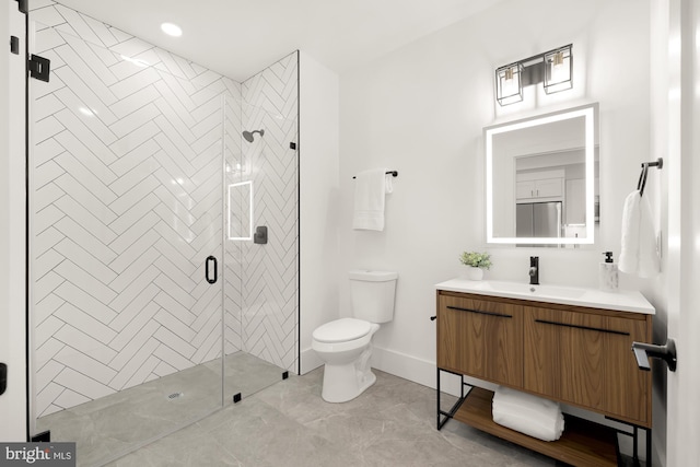 bathroom with walk in shower, oversized vanity, and toilet