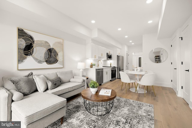 living room with light hardwood / wood-style flooring