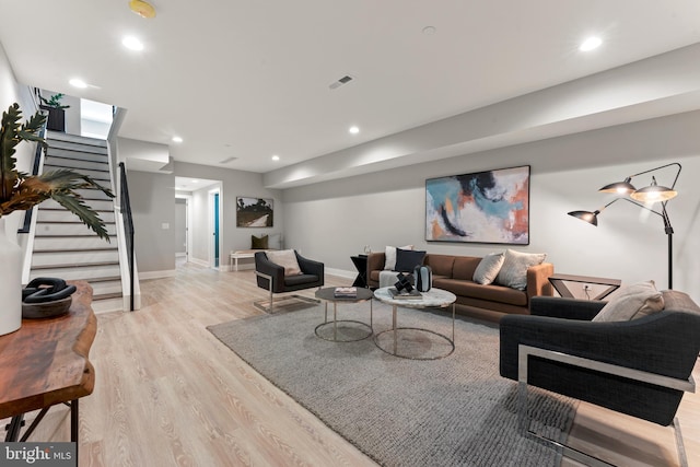 living room with light hardwood / wood-style flooring