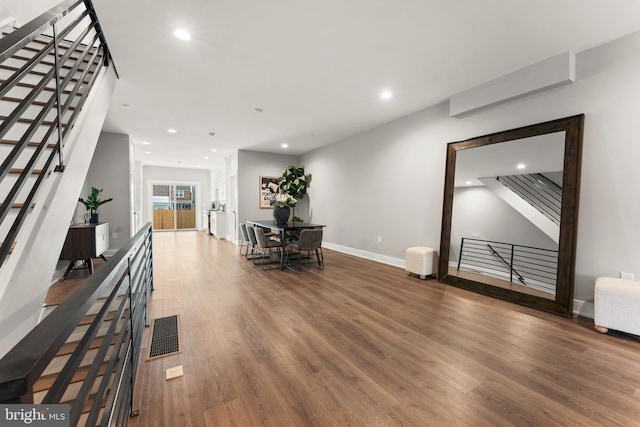 unfurnished living room with hardwood / wood-style floors