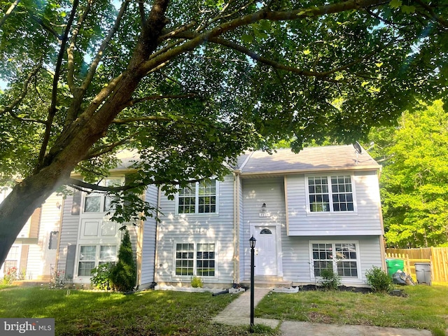 raised ranch with a front lawn