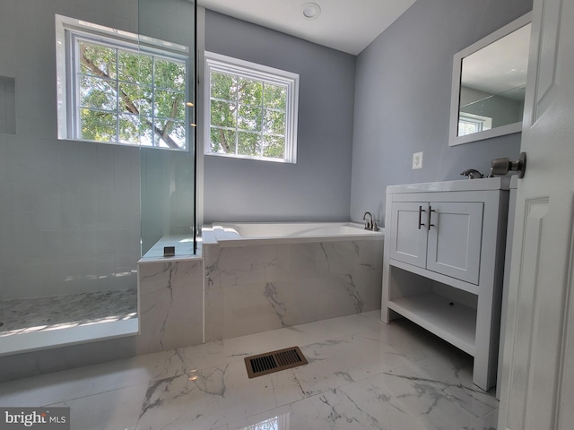 bathroom featuring tile floors and tiled bath