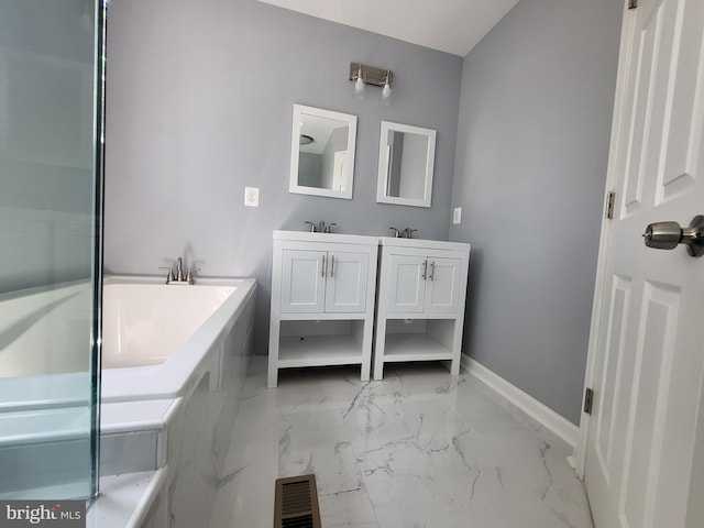 bathroom featuring tile floors, dual sinks, vanity with extensive cabinet space, and a bath