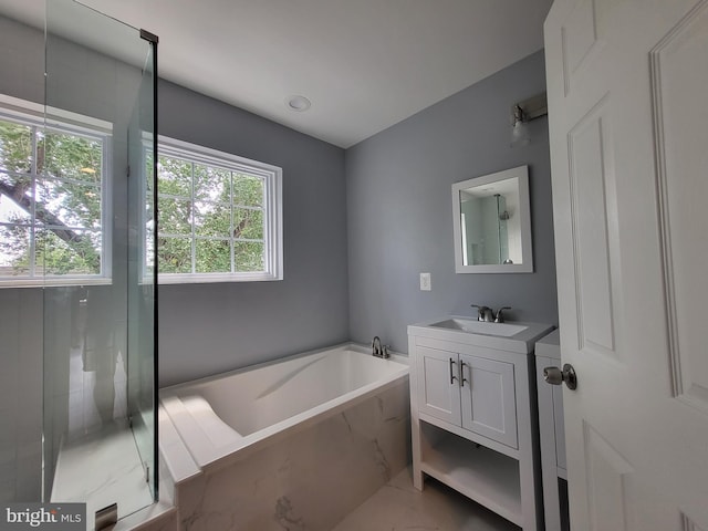 bathroom featuring vanity and plus walk in shower