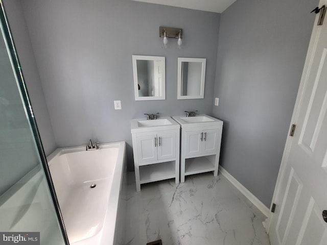 bathroom with tile floors, double vanity, and a washtub