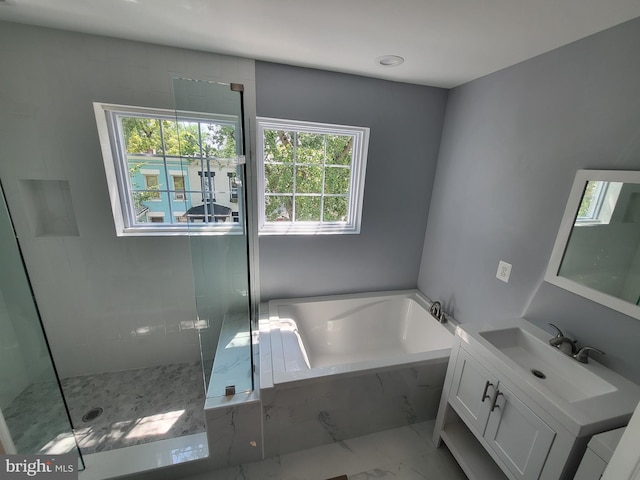 bathroom with tile floors, independent shower and bath, and large vanity