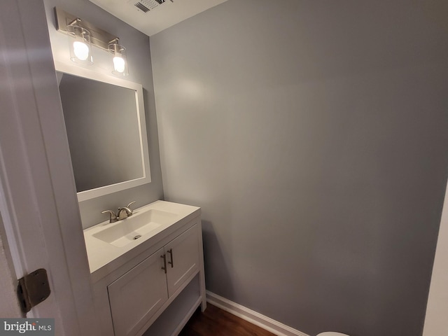 bathroom with wood-type flooring and vanity