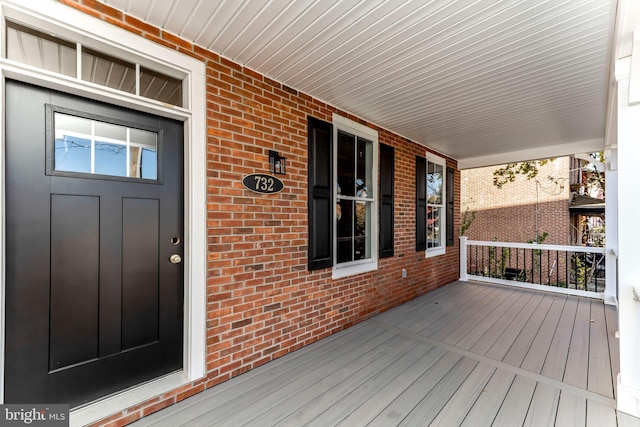 wooden terrace featuring a porch