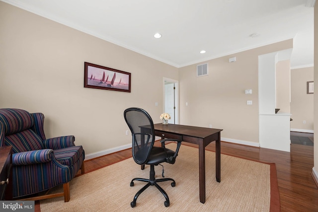 home office with ornamental molding and wood-type flooring