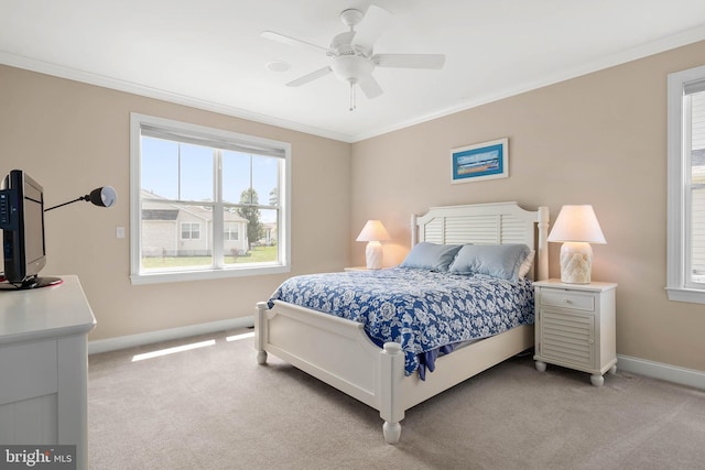 bedroom featuring ornamental molding, light carpet, and ceiling fan