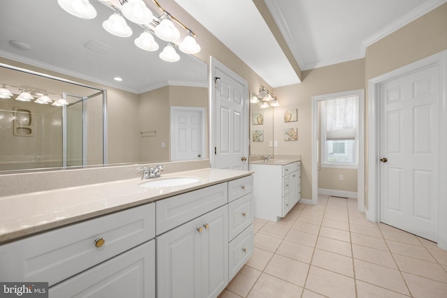 bathroom featuring vanity, ornamental molding, and tile patterned floors