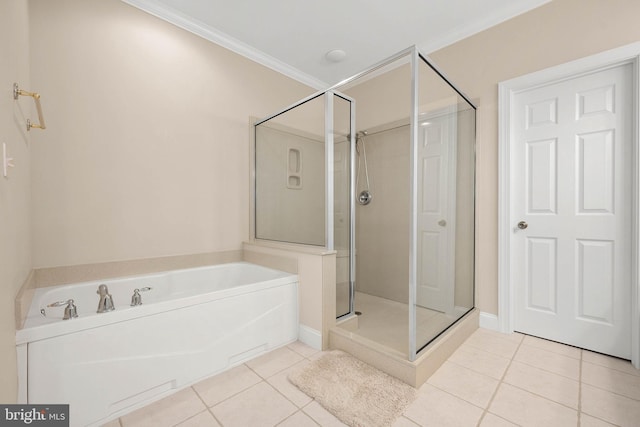 bathroom with crown molding, tile patterned floors, and separate shower and tub